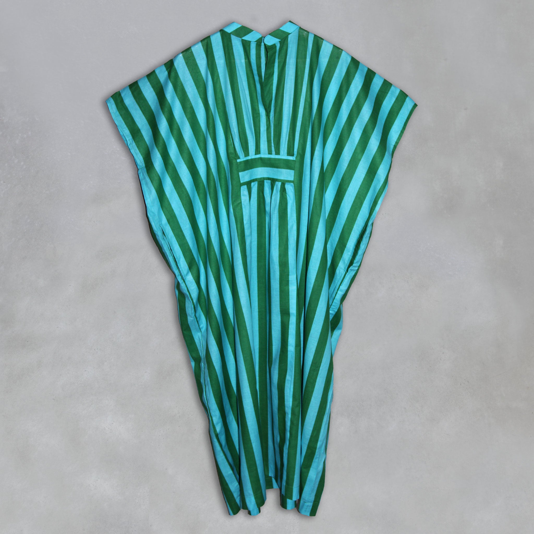 Green and blue striped  kaftan on a grey background