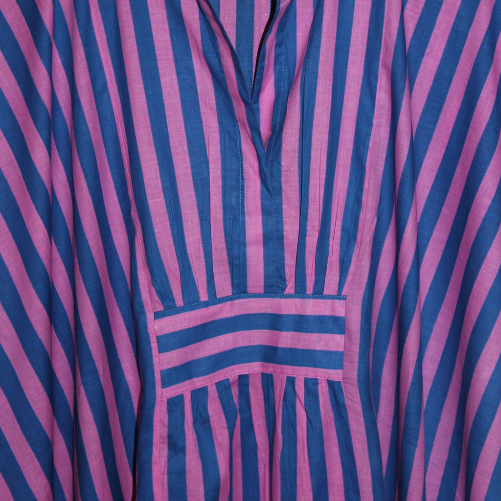 Close-up of a pink and blue striped Kaftan, detail of front rib detail