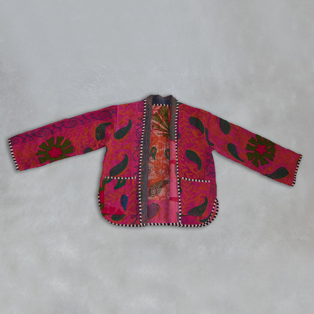 Colourful pink Kantha embroidered jacket on a grey background