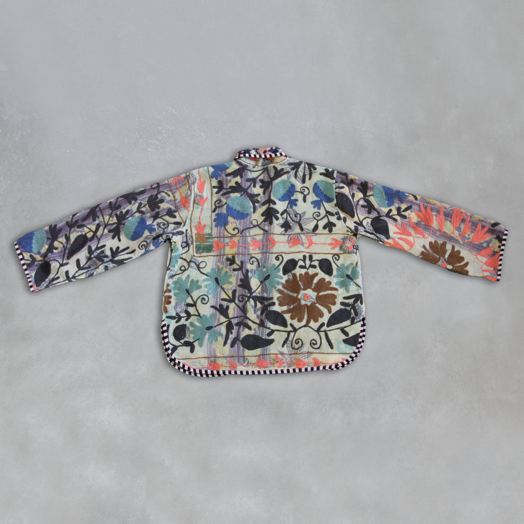 Colourful floral-patterned Kantha Jacket on a grey background