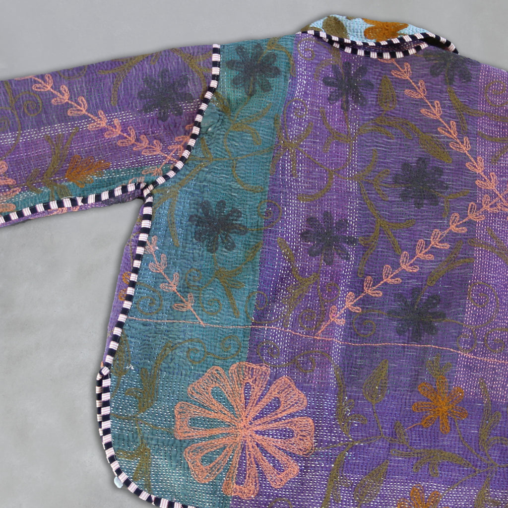 Embroidered fabric with floral patterns on a Knatha jacket by Colourstory